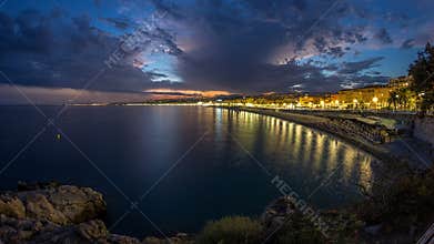 Waterfront of Nice city and Mediterranean Sea day to night timelapse