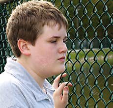 Boy in fence