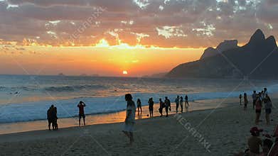 People enjoying the sunset at Ipanema Beach, Rio de Janeiro