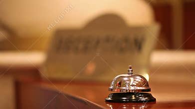 Call at old hotel bell on a wood stand