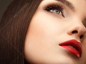 Woman Eye With Beautiful Makeup and Long Eyelashes. Red Lips. Hi
