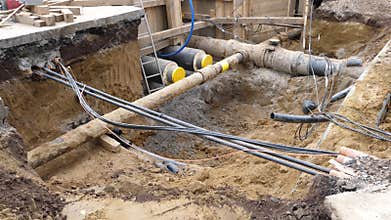 Installation of district heating lines. Large open excavation site