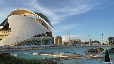 City of Arts and Sciences in Valencia, Spain. Camera glides along Palau de les Arts Reina Sofia. Golden hour light.