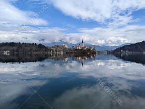 The island of Bled with the julian alps in the background