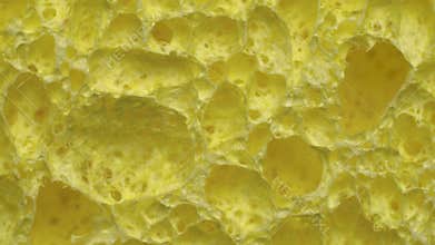 Cellulose sponge rotating in circle. Abstract background texture macro