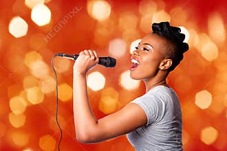 Singing karaoke woman with microphone