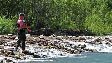 Fisherman and fly fishing
