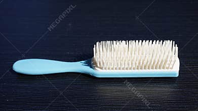 blue and white women& x27;s and men& x27;s hair comb