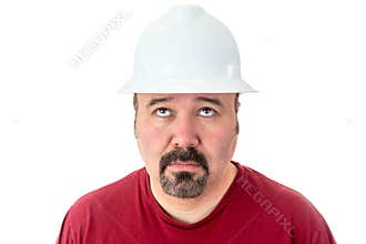 Glum looking workman looking for inspiration
