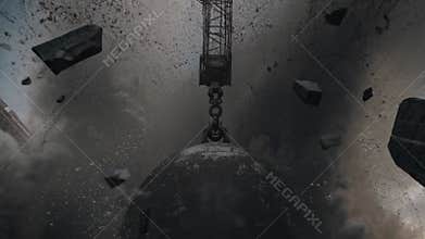 Wrecking ball destroying a concrete structure, generating dust and debris