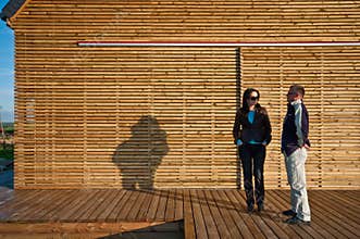 Clients outside eco-friendly house