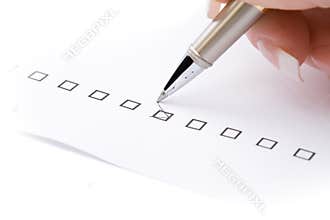 Woman hand marking a check box