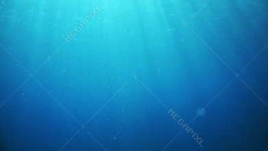 Abstract underwater scene sunrays and air bubbles in deep sea