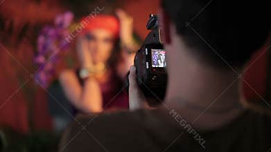 Fashion photo shoot with photographer and beautiful female model
