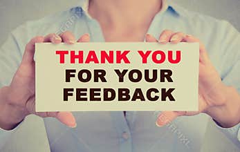 Businesswoman hands holding card with Thank you for your feedback message