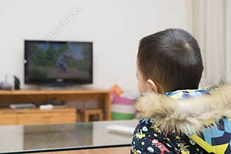 Chinese kid watching cartoon TV