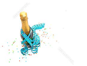 Top view of champagne bottle with confetti