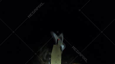 Horizontal footage of a extinguishing candle