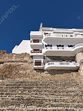 Charming Moroccan cityscape with white balconies above fortress walls