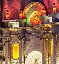 Historic architecture shines at night in La Rochelle with bright colors and detailed stonework