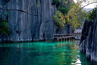 Twin Lagoon on paradise island with sharp limestone rocks, tropical travel destination - Coron, Palawan,