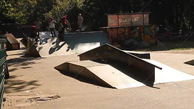 Teens practicing skateboard