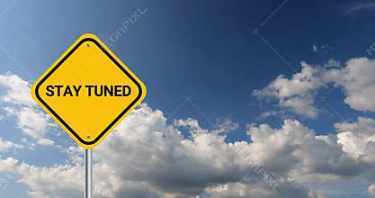 stay tuned traffic sign on blue sky