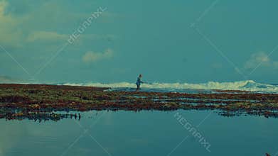 Man Fishing on Tropical Reef