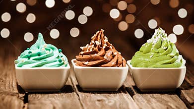 Colorful row of frozen yogurt desserts at a party