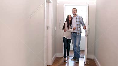 Attractive couple opening the front door