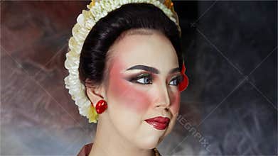 Artistic Close Portrait of Elegant Indonesian Bride with Traditional Hairstyle