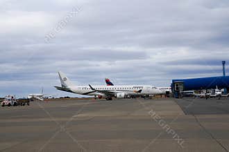 Latam Airlines Airbus A321 and Amelia Embraer E190LR in Silversea Expeditions livery at the terminal gates in Punta Arenas airport