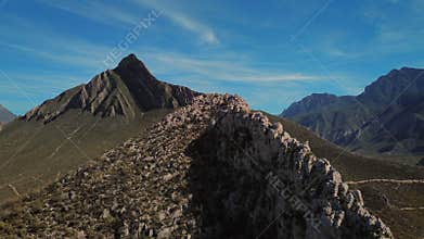 Pico Morteros mountain peak aerial forward movement through sky