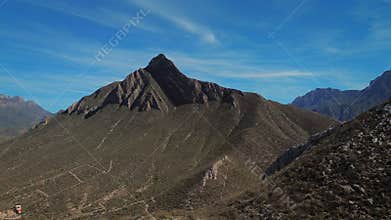 Pico Morteros mountain peak aerial forward movement through sky