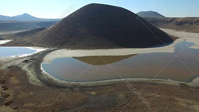 Aerial view of tuff ring cone and volcanic crater lake maar in a barren caldera of Konya Turkiye, desert, basin, anatolia