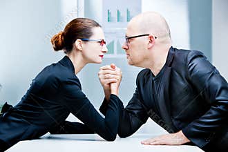 Arm wrestling woman VS man