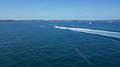 Torbay, South Devon, England: DRONE VIEWS: A motor boat cruises across the bay