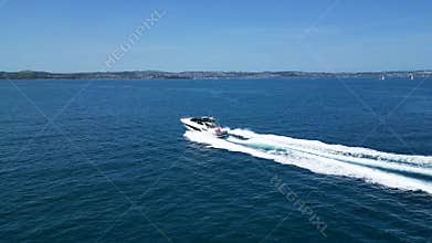 Torbay, South Devon, England: DRONE VIEWS: A motor boat cruises across the bay