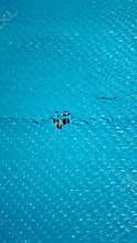 Blue woven plastic fabric texture with hole macro pattern