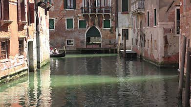 Gondola glides through Venice canal with romantic travel mood classic water transport detail, boat, along, carries, venetian