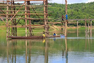 Under construction old wooden bridge Mon in Sangkhla Buri