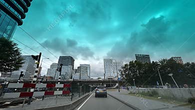 Modern business district street view with glass office towers, elevated roadway