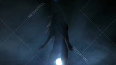 Dancing silhouettes of woman in a nightclub. Slow