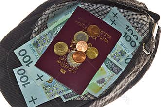 Money and passport in cap