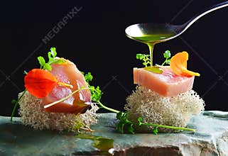 Fine dining, fresh raw ahi tuna sashimi served on an ocean sponge