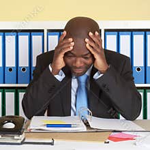 African businessman at office in crisis
