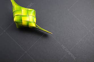Ketupats, a natural rice casing made from young coconut leaves for cooking rice on white background
