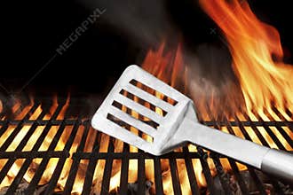 Spatula on the Flaming BBQ Grill