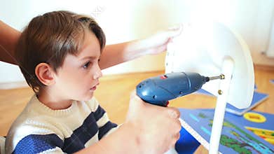 Little Boy using diy tool
