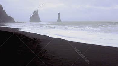Huge arched black sand beach in Iceland